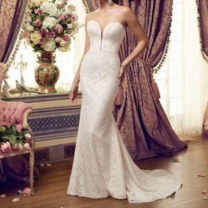 Strapless wedding gown with low back built in push up by Mikaella.